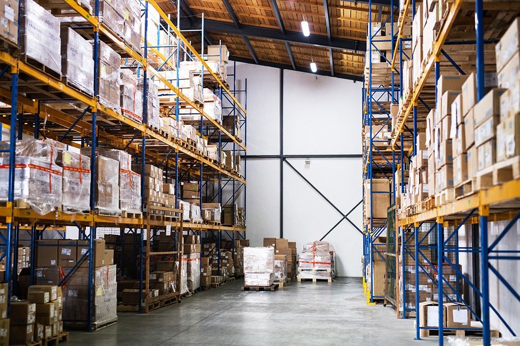 Warehouse requiring AI price optimization with shelves full of wholesale goods ready for distribution